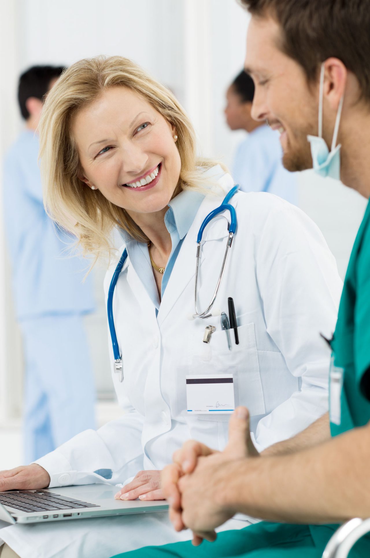 nurse taking hand of woman