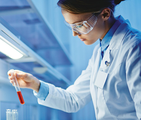 What are biosimilars? woman in lab / goggles